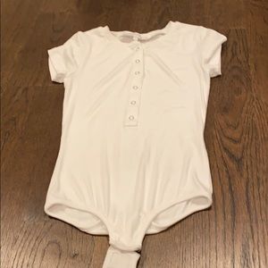 white snap up bodysuit